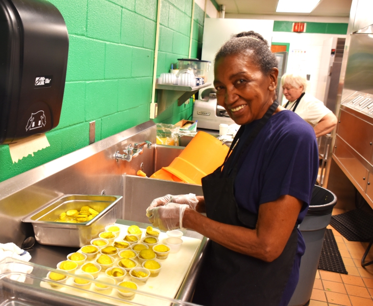 Shirley Caraway and Margery Cardinal prepare for lunch at the SPC cafeteria.