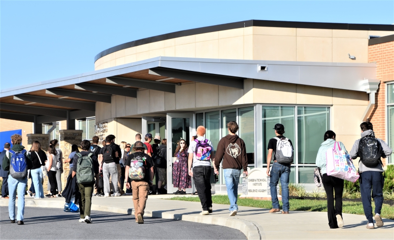 Student enter the Career and Technical Institute and Resilience Academy building