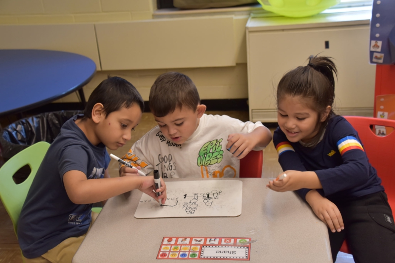 SPC students share a whiteboard and draw together