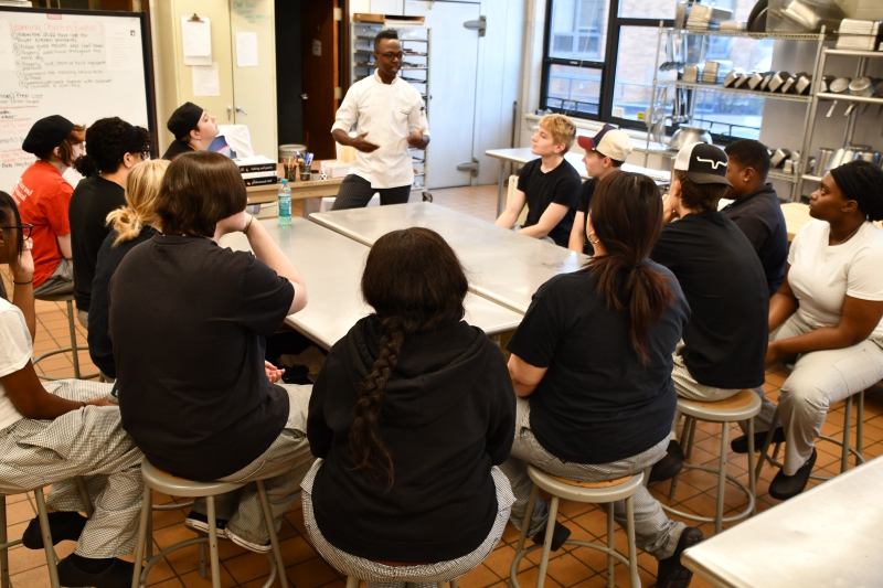 Culinary Institute of America instructor Jesse Jackson III, a CTI graduate himself, speaks to students in chef Amanda Scoca's class Thursday, Nov. 21.