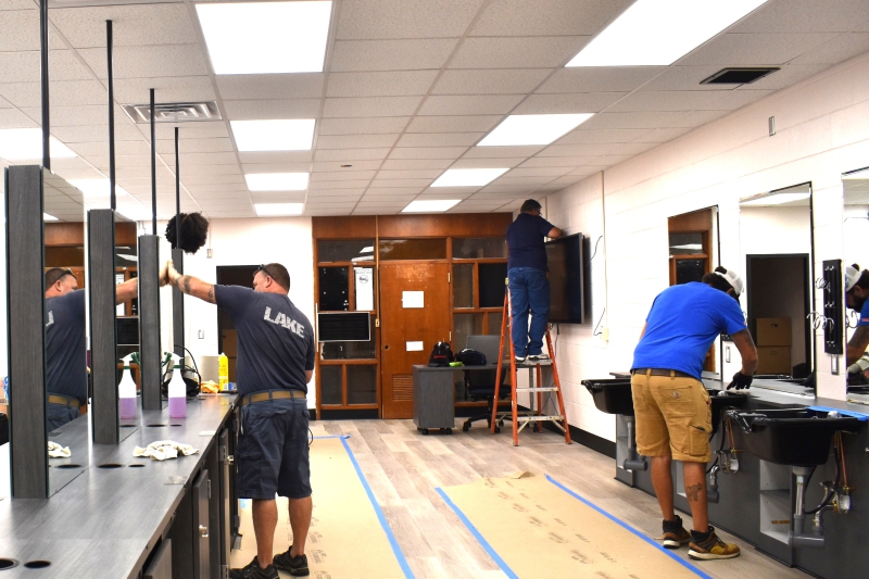 Facilities and Operations staff work on the new cosmetology classroom.