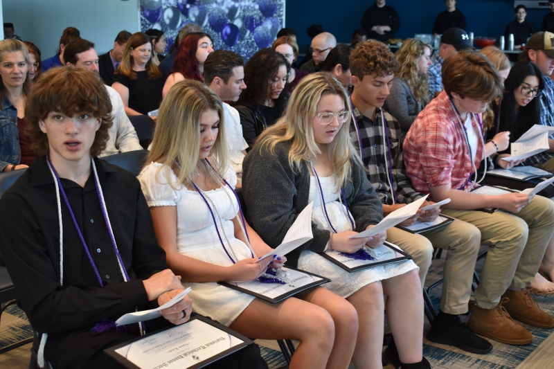 Students read the National Technical Honor Society pledge during the 2024 induction ceremony