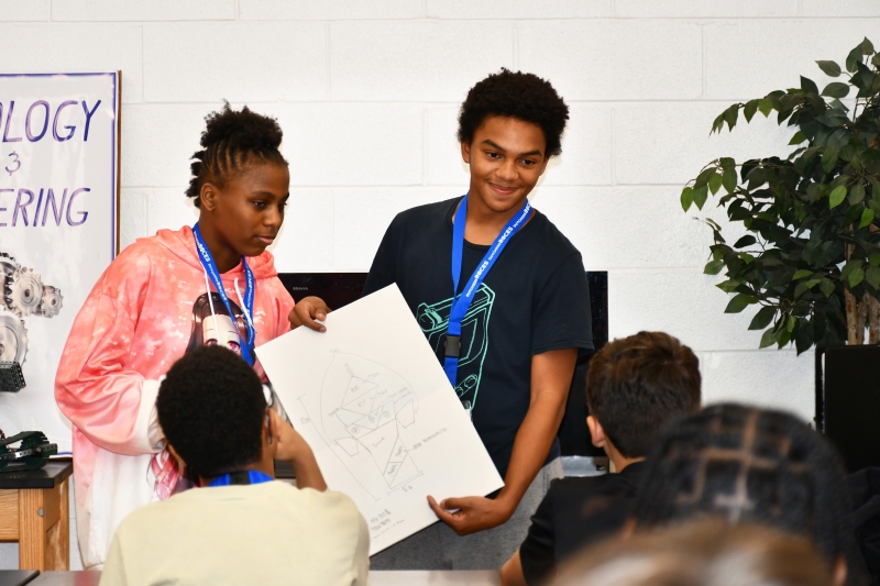 Alexis Rihanna Bali-Spence (Poughkeepsie) and David Mahecha (Arlington) present their design to classmates in Design and Drawing Principles.