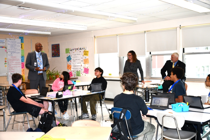 Dutchess BOCES Deputy Superintendent Jodi DeLucia, Wappingers Central School District Superintendent Dwight Bonk, Poughkeepsie Central School District Superintendent Eric Rosser and others visit P-TECH students in their math class to discuss the program