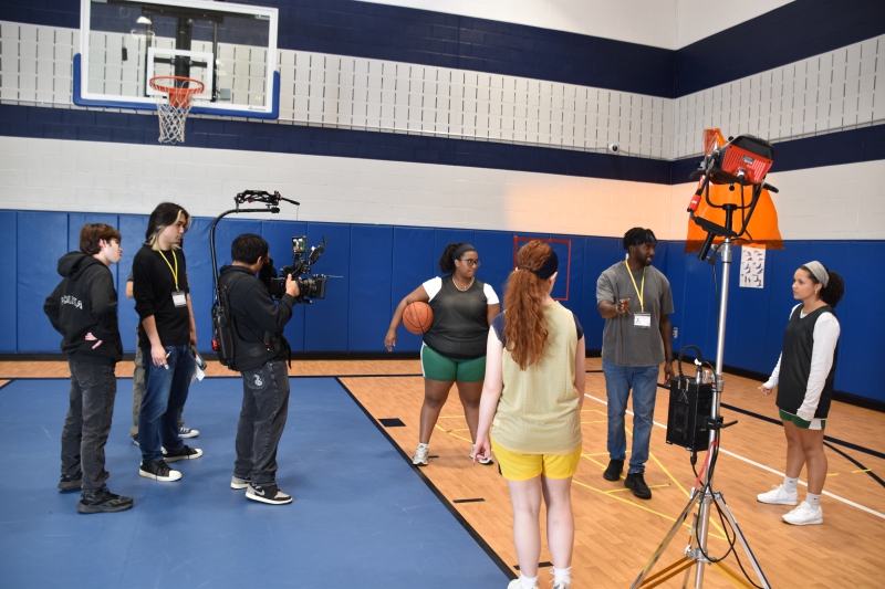Director Paul Thompson gives direction to the cast and crew.