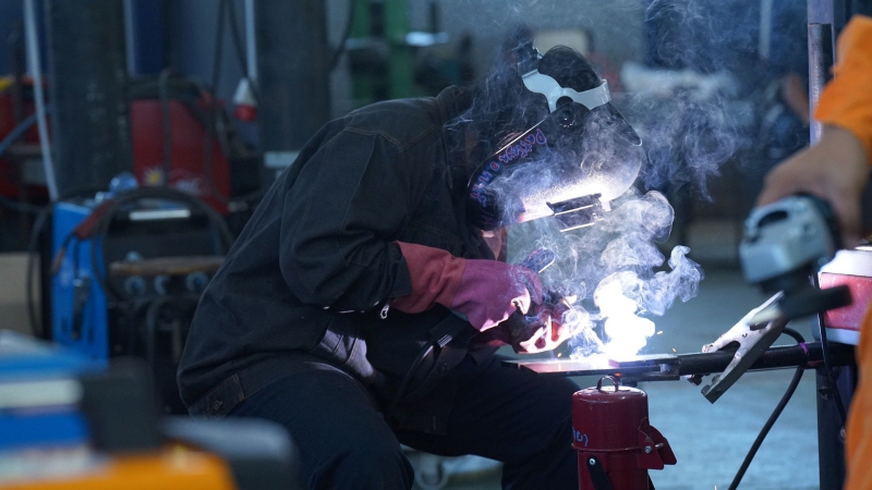 A student learns to weld