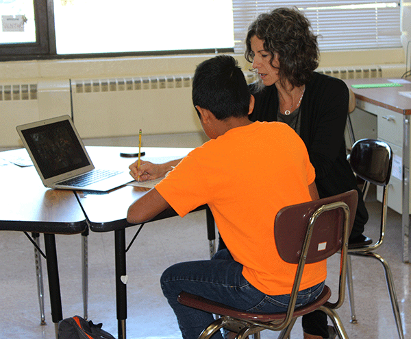 [PIC] SIFE Program Instructor Works Individually With An English As A New Language Student