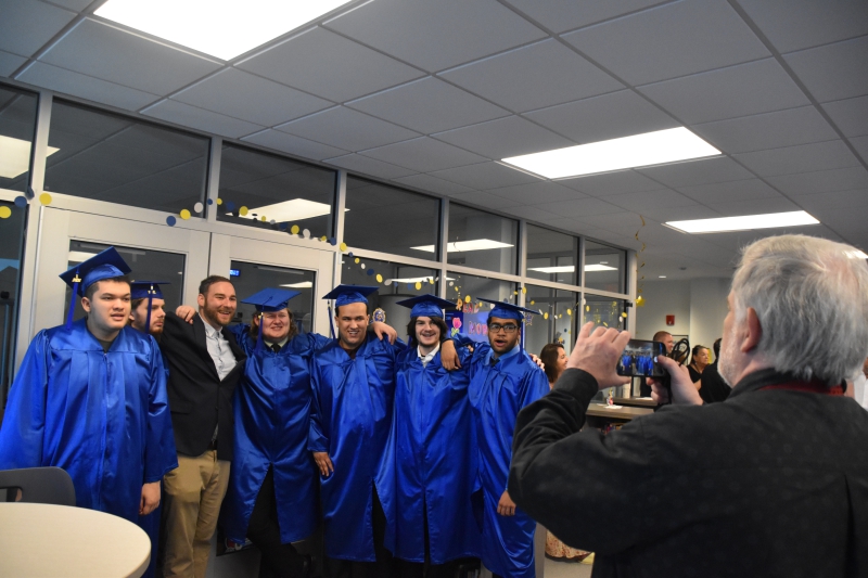 Students and staff posed for photos prior to the start of the ceremony.