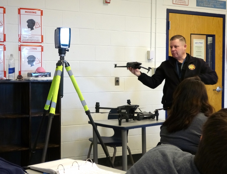 A DCSO detective demonstrates how a drone can be used in crime scene investigation.