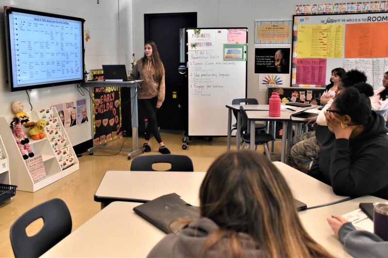 Early Childhood Education Student Ayanna Morales presents a lesson plan about holidays to classmates and CTI teachers.