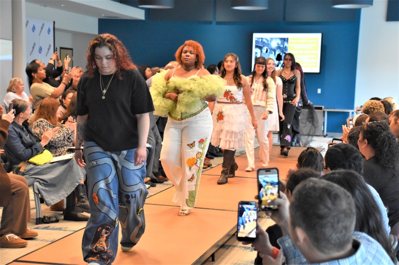 Senior student designers and their models walk the runway for an encore at the end of the show.