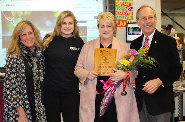 [PIC] Cosmetology teacher Sharon Myers being presented with Q92 Teacher of The Month Award