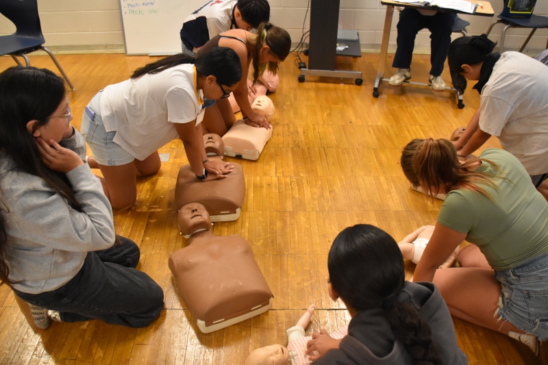 n CTI's Summer Middle School Experience, students perform CPR on dummies while listening to the Bee Gees classic "Stayin' Alive" as it sets the perfect tempo to keep time with chest compressions. 