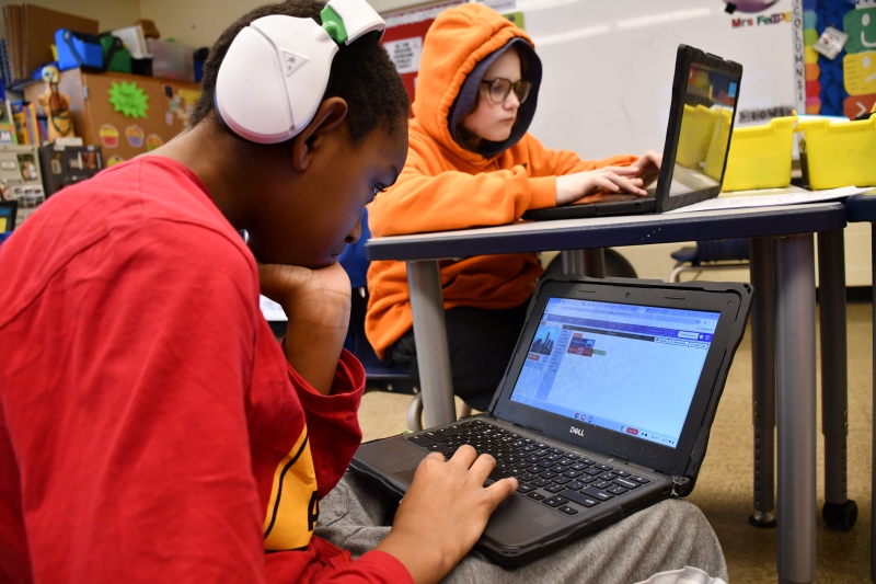 Dylan Clarke and Parker Fors work on their coding projects in Kelly Felipe's class at Salt Point Center