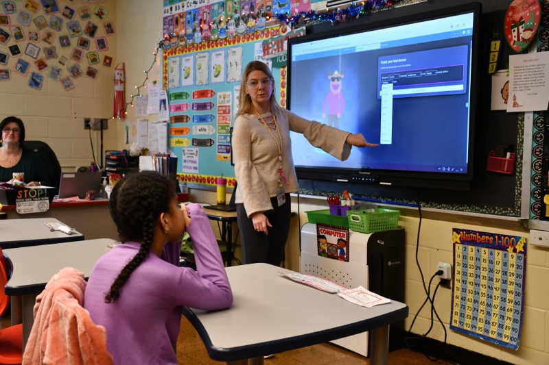 SPC student Aria Williams tells teacher Menalie McAvoy her choice for a character.