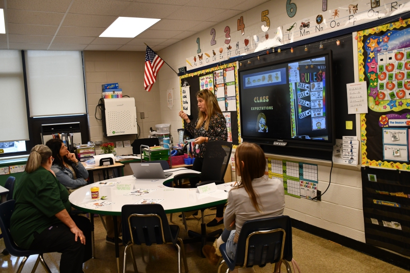SPC Teacher Jennifer Whalen speaks to parents during Open House.