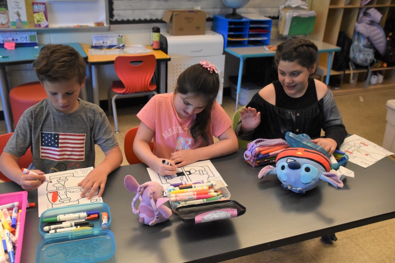 Students in Christine Ciccone's class color in life jackets.